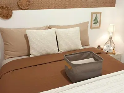 a bedroom with a bed with a suitcase on it at SMDC FAME Apartment in Manila