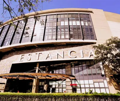 a building with a sign that reads eskenazi at Heart of Ortigas in Manila