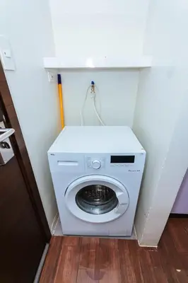 a washer and dryer in a small room at 2 Bedroom Penthouse Air condo Makati Gym Swim Park 300 Mbps in Manila