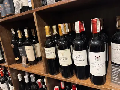 a bunch of bottles of wine on a shelf at 2 Bedroom Penthouse Air condo Makati Gym Swim Park 300 Mbps in Manila