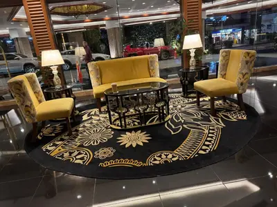 a store with two chairs and a table and a rug at 2 Bedroom Penthouse Air condo Makati Gym Swim Park 300 Mbps in Manila