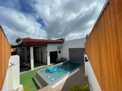 a swimming pool in the backyard of a house at Cozy Private Resort with Pool, Hijas Villa Binangonan in Binangonan