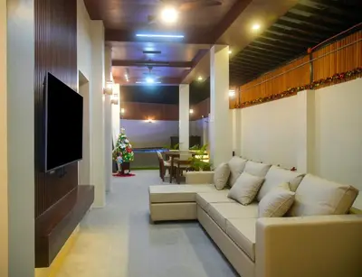 a living room with a couch and a flat screen tv at Cozy Private Resort with Pool, Hijas Villa Binangonan in Binangonan