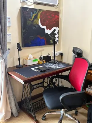 a desk with a computer and a red chair at Mc Kinley Home Away from Home in Manila