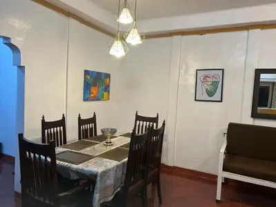 a dining room with a table and chairs at Home in Imus Kawit with free mini pool in Kawit