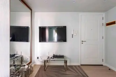 a living room with a glass table and a mirror at Azure Urban Resort Residences,BORACAY tower model unit in Manila
