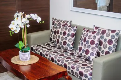 a living room with a couch and a coffee table at Urban Charm Cozy Meet 51 Air Swim Gym Park 300Mb in Manila