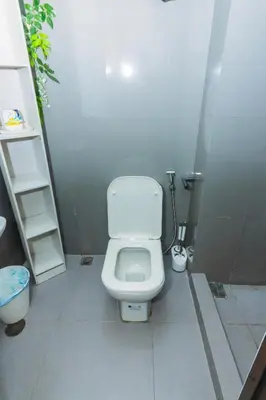 a bathroom with a white toilet in a stall at Urban Charm Cozy Meet 51 Air Swim Gym Park 300Mb in Manila