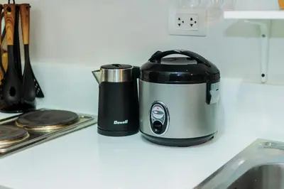 a toaster sitting on a counter next to a sink at Urban Charm Cozy Meet 60 Air Swim Gym Park 300Mb in Manila
