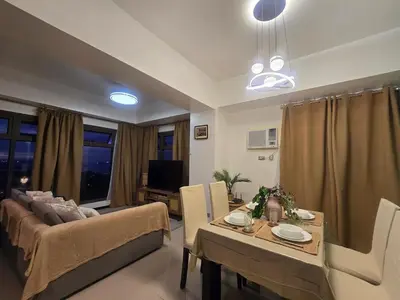 a living room with a couch and a table at The Radiance of Manila Bay in Manila