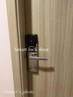 a door knob with a smart lock on it at JUVREY 1 BR Studio Unit with balcony in Manila