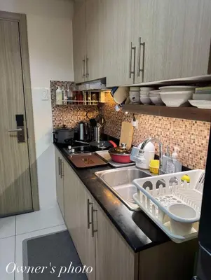 a kitchen with a sink and a counter top at JUVREY 1 BR Studio Unit with balcony in Manila