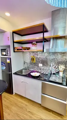 a kitchen with a sink and a counter top at Azure Urban Resort Residences, 1BR Santorini 18th floor in Manila
