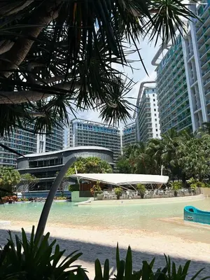 a view of a beach in a city with tall buildings at Azure Urban Resort Residences, 1BR Santorini 18th floor in Manila