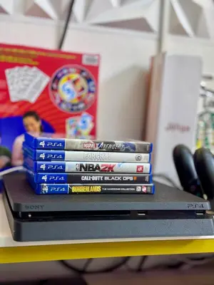 a stack of dvds sitting on top of a desk at Azure Parañaque, 1BR Bahamas 15th floor in Manila