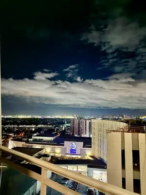 a view of a city skyline at night at Azure Parañaque, 1BR Bahamas 19th floor in Manila