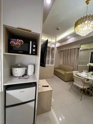 a room with a kitchen and a living room at Radiance manila bay in Manila