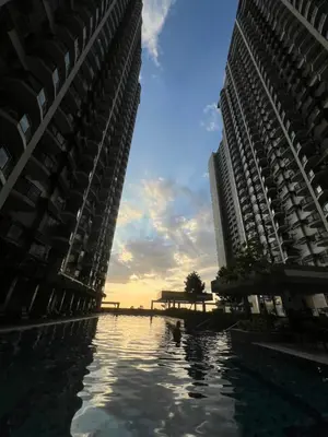 two tall buildings next to a body of water between them at Radiance manila bay in Manila