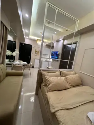 a living room with a couch and a table at Radiance manila bay in Manila