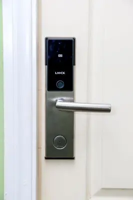 a door with a lock on a white door at Azure Urban Resort Staycation 2 bedrooms beach view, 9th floor in Manila