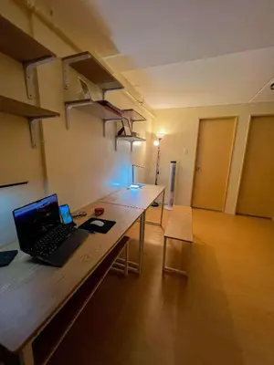 an office with a desk with a laptop on it at Jungle Hostel 1062 in Manila