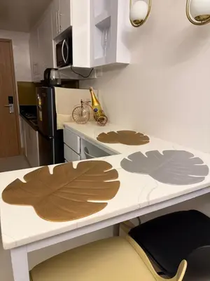 a kitchen with a counter top with wooden leaves on it at Glamorous SMDC Shore 3, 5 Star Rate BnB-Wifi-Netflix in Manila