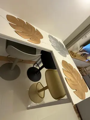 a room with a desk with wings on the wall at Glamorous SMDC Shore 3, 5 Star Rate BnB-Wifi-Netflix in Manila