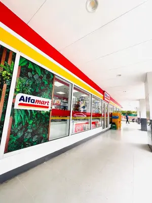 an empty mall with an atm sign on the wall at Sea Residence MOA - Paul Condotel in Manila