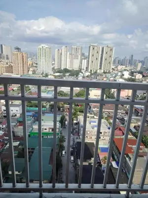 a view of a city from a balcony at Affordable Breeze Residence unit 2118 in Manila