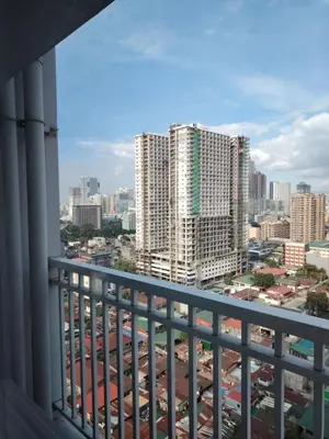 a view of the city from a balcony at Affordable Breeze Residence unit 2118 in Manila
