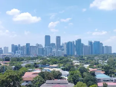 a cityscape of a city with tall buildings at Delet TEA in Manila