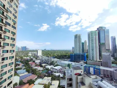 a city view of a city with tall buildings at Delet CITADEL in Manila