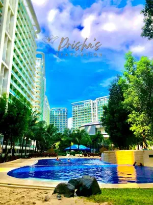 a large swimming pool in front of a resort at Prisha Staycation in Manila