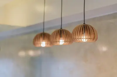 a group of three lights hanging from a ceiling at Coasis at SMDC Coast Residences in Manila
