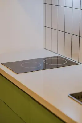 a kitchen counter with a stove top in a kitchen at Coasis at SMDC Coast Residences in Manila