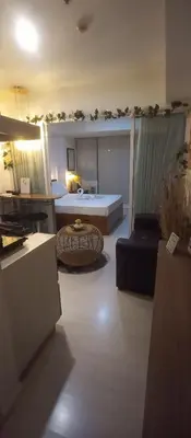 a large living room with a bed and a couch at Casa Crisav Staycation place at AZURE in Manila