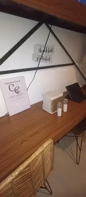 a wooden table with a microwave on top of it at Casa Crisav Staycation place at AZURE in Manila