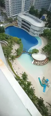 a model of a resort with a beach and a building at Casa Crisav Staycation place at AZURE in Manila