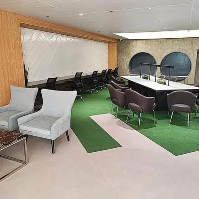 a conference room with chairs and a table and a projection screen at Micasa at Green 2 Residences in Dasmariñas