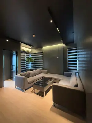 a living room with a couch and a table at Malate Bayview Mansion 37M in Manila