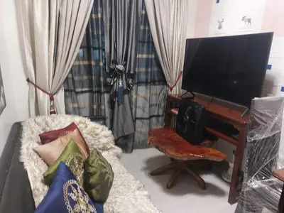 a living room with a tv and a piano at Bellflower florida sun in General Trias
