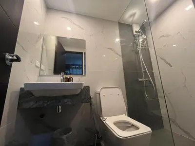 a bathroom with a toilet and a sink and a shower at Gentry Manor 2-Bed Near MOA&NAIA Okada Seaviw TV Netflix 17U in Manila