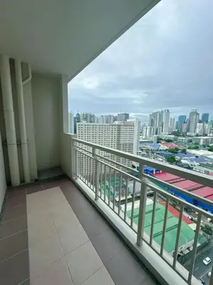a balcony with a view of a city at Brixton place 2815 Weston tower in Manila