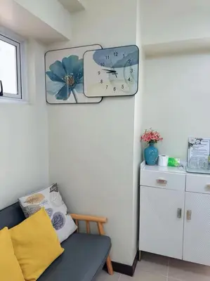 a small room with a couch and a mirror at Brixton place 2815 Weston tower in Manila