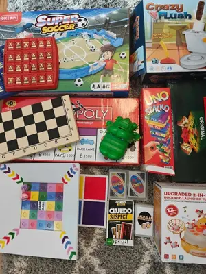 a group of games and other toys on a table at Serenity Escapes by Aj in Manila