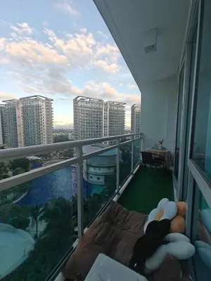 a balcony with a view of a city at Serenity Escapes by Aj in Manila
