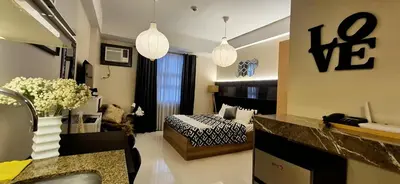 a room with a bedroom with a bed in it at A&G Condotel at 101newport Near NAIA T3 in Manila