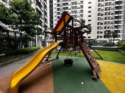 a playground with a slide in a city at Dhayz Staycation in Manila