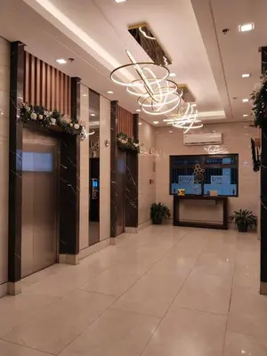 a lobby with a large hallway with a large chandelier at Dhayz Staycation in Manila