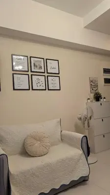a bedroom with a bed with a pillow on it at J&M Cozy Retreat - McKinley Hill, BGC in Manila
